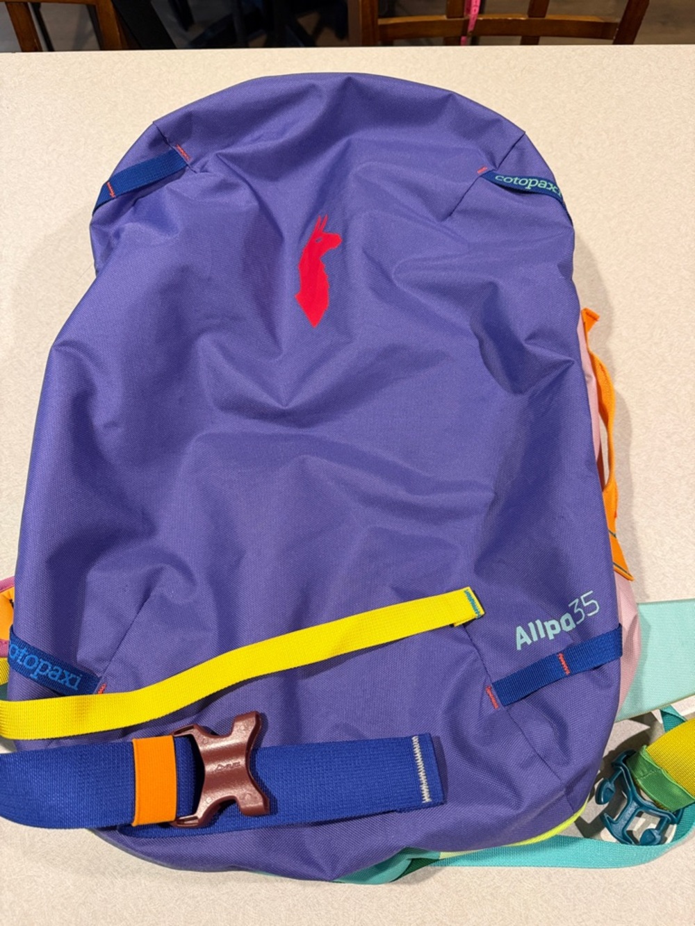 cotopaxi Purple Allpa 35L Backpack with Yellow and Red Accents